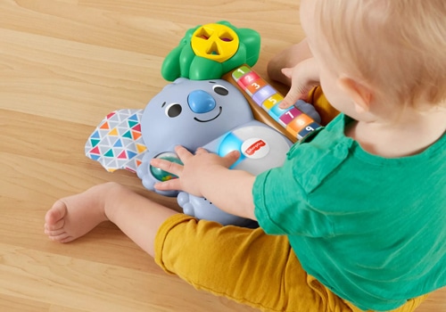 kid playing with Fisher Price – Linkimals Counting Koala