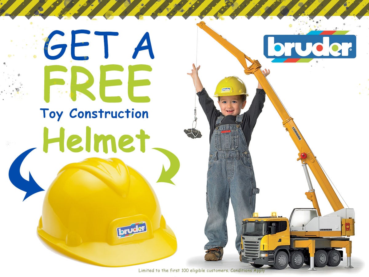 Boy wearing a yellow Bruder construction helmet