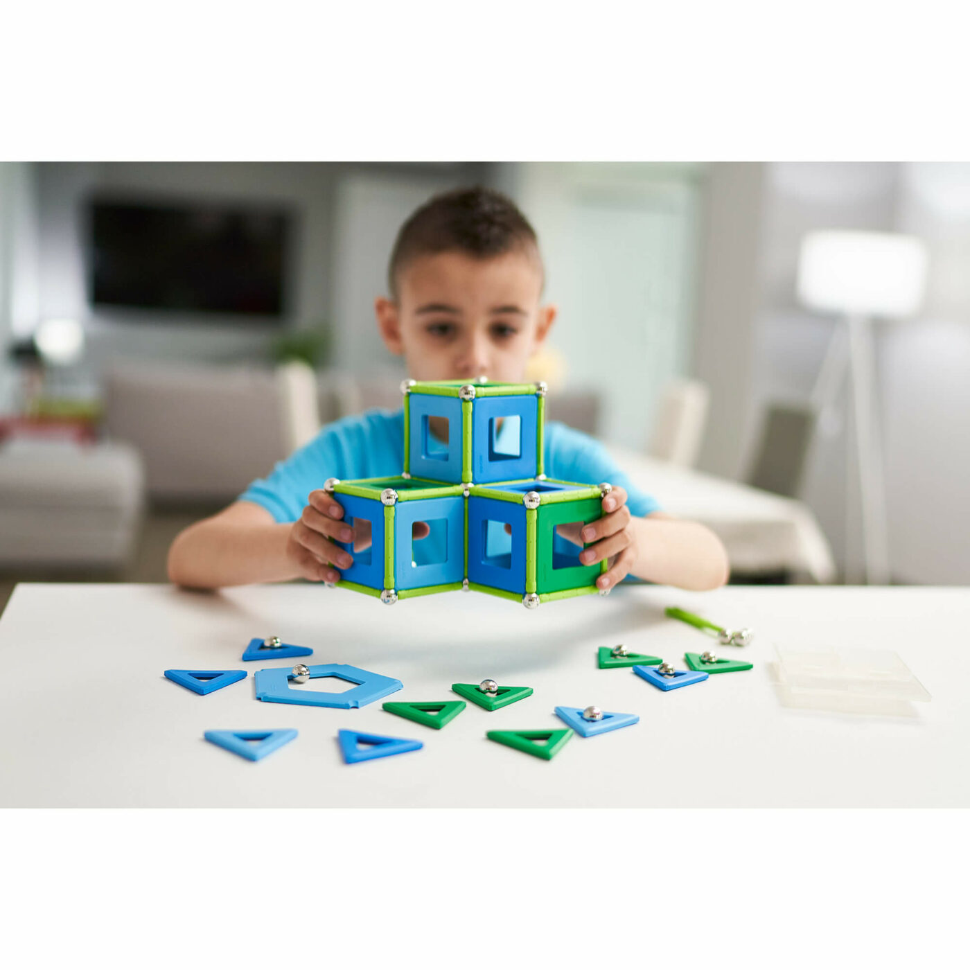 Geomag-Classic-Classic-Panels-Item-473-Product-Images-Lifestyle-Boy-admiring-the-model-that-he-just-finished-to-build