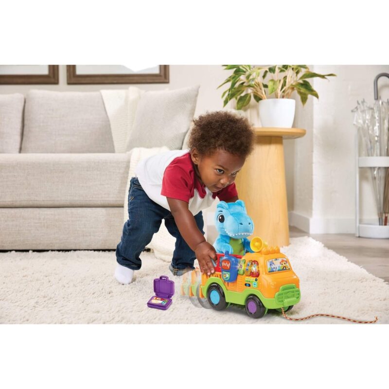 Toddler playing with VTech Baby Dino Rescue Truck