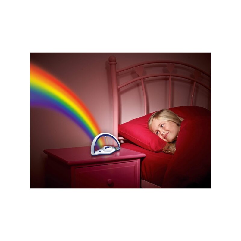 Child relaxing at bedtime with rainbow projector light.