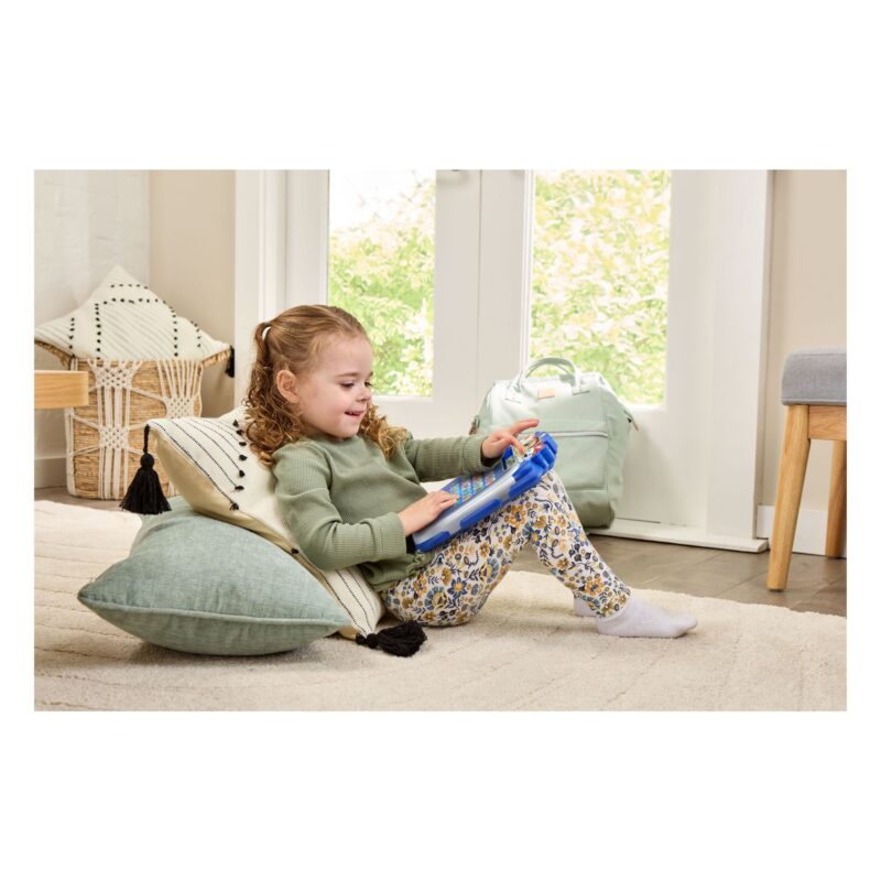 Child playing with VTech PAW Patrol Pup Pad interactive learning toy at home