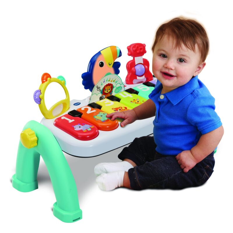 Baby playing with interactive music activity toy