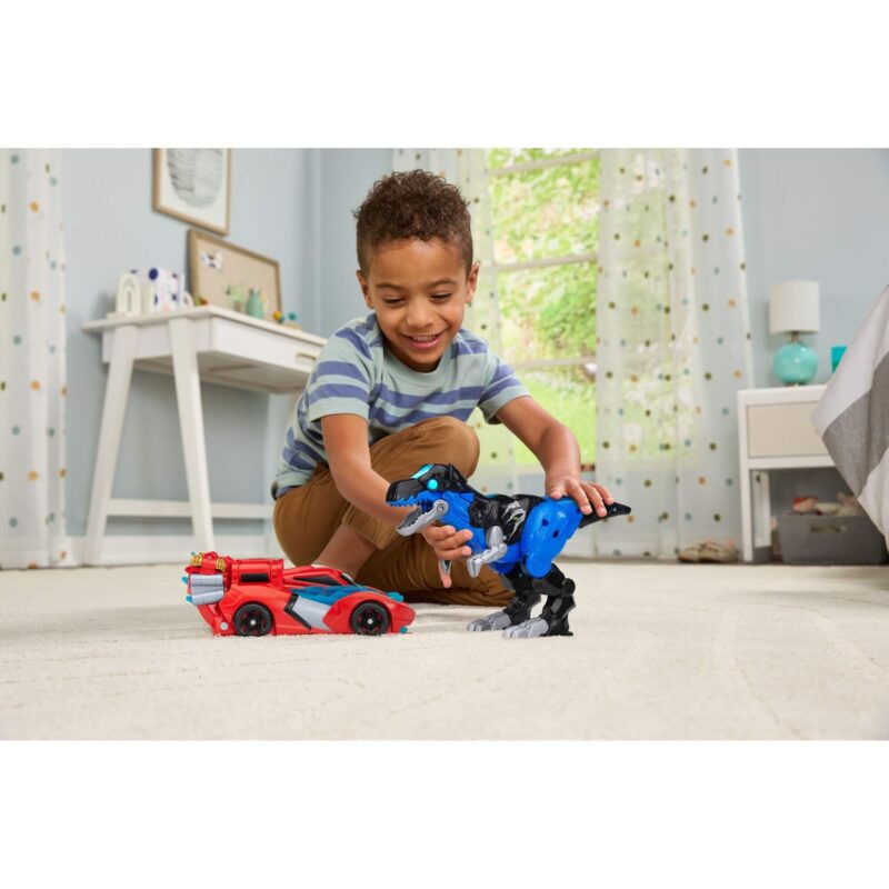 Boy playing with VTech Switch & Go Armour Up Dragon T-Rex toy