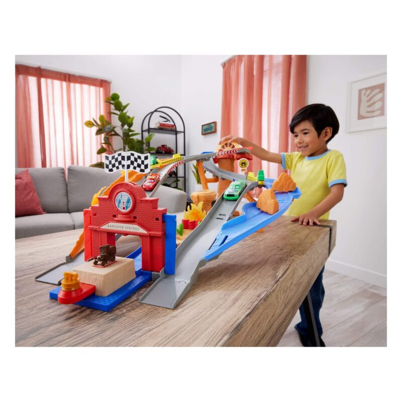 Child playing with Radiator Springs Race & Rescue playset