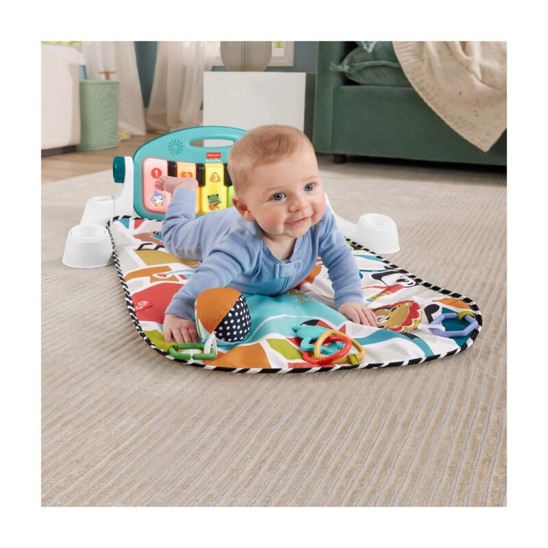 Baby tummy time on Fisher-Price blue piano gym