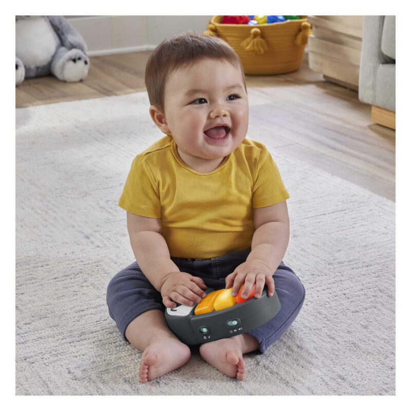 Baby playing with Fisher-Price Jumperoo toucan toy