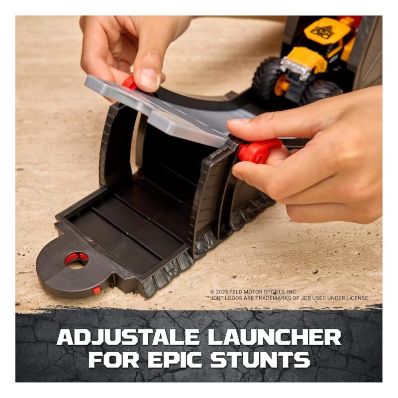 Hands adjusting Monster Jam launcher ramp for stunts